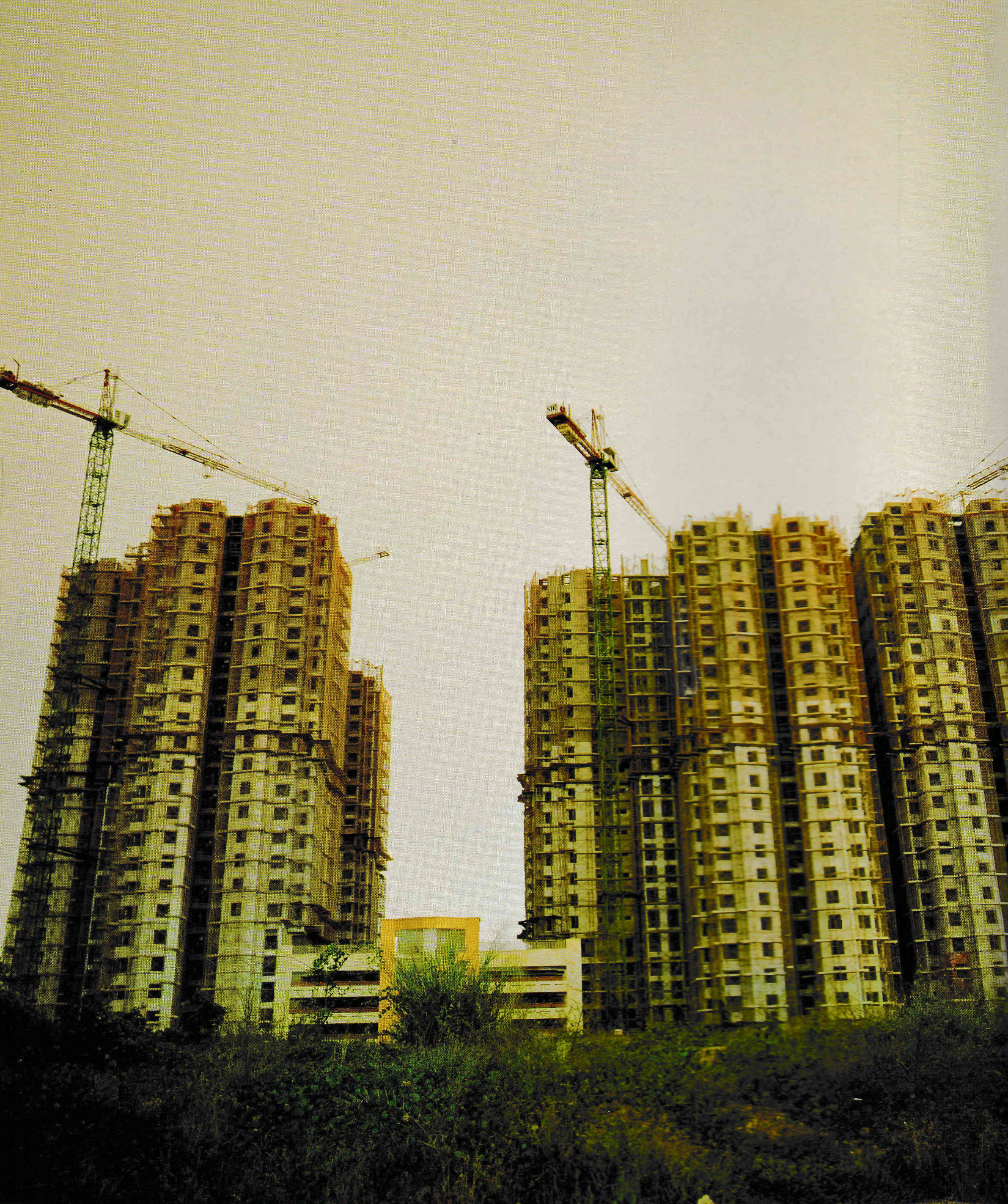 Image of an urban skyline under construction
